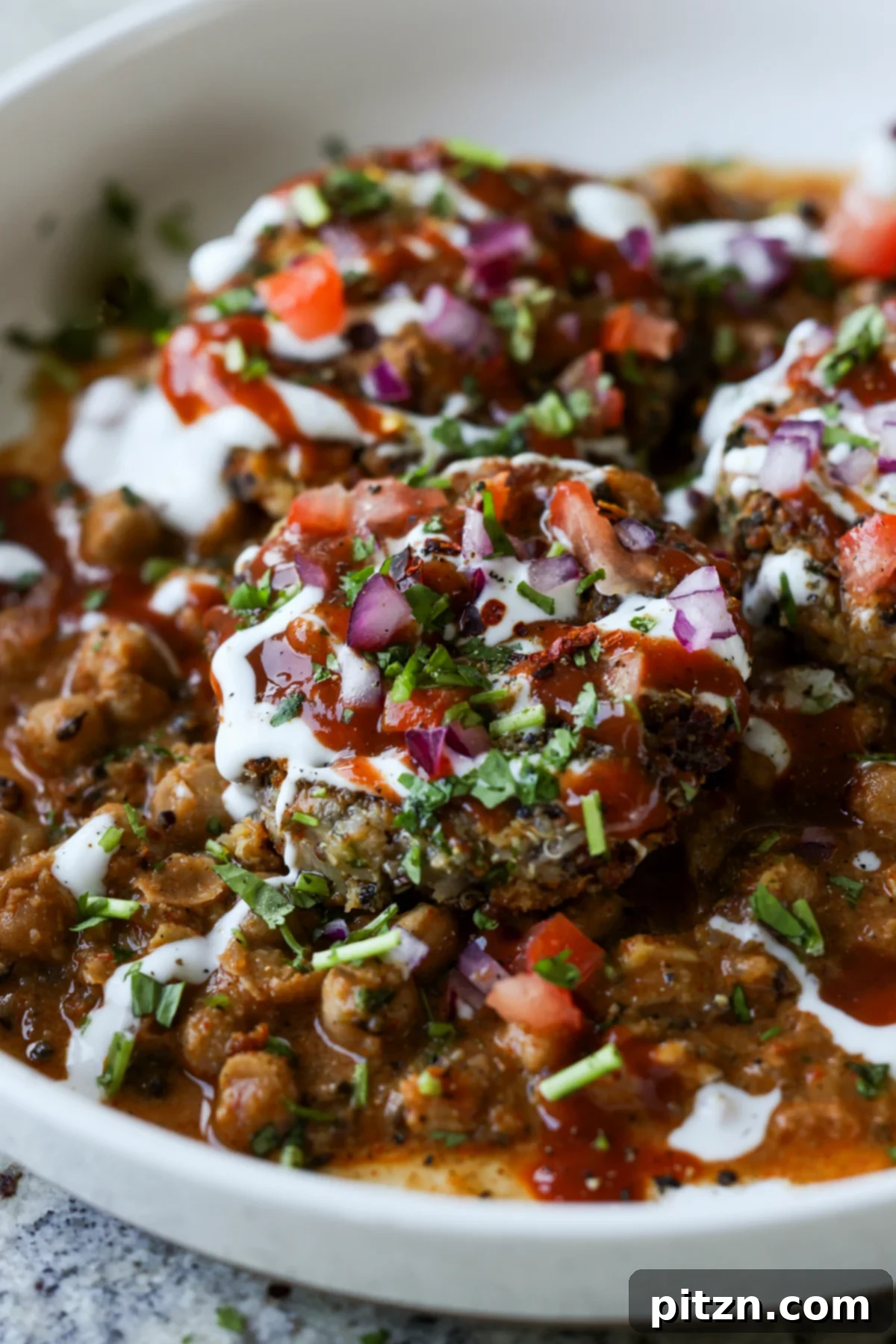 Flavorful Tikki Chole Potato Quinoa Patties and Chickpea Curry 2 close-up of tikki chole in a bowl after adding toppings