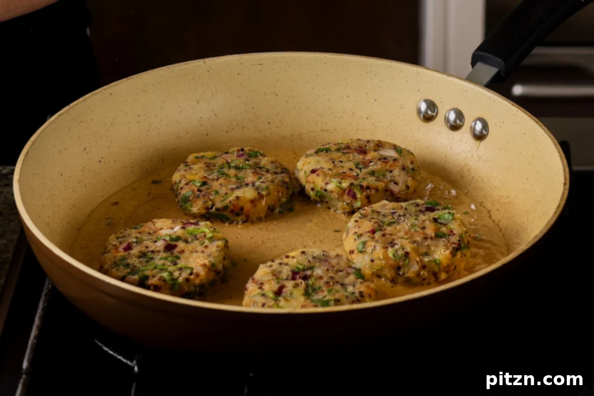 Flavorful Tikki Chole Potato Quinoa Patties and Chickpea Curry 16 frying the tikkis in the pan