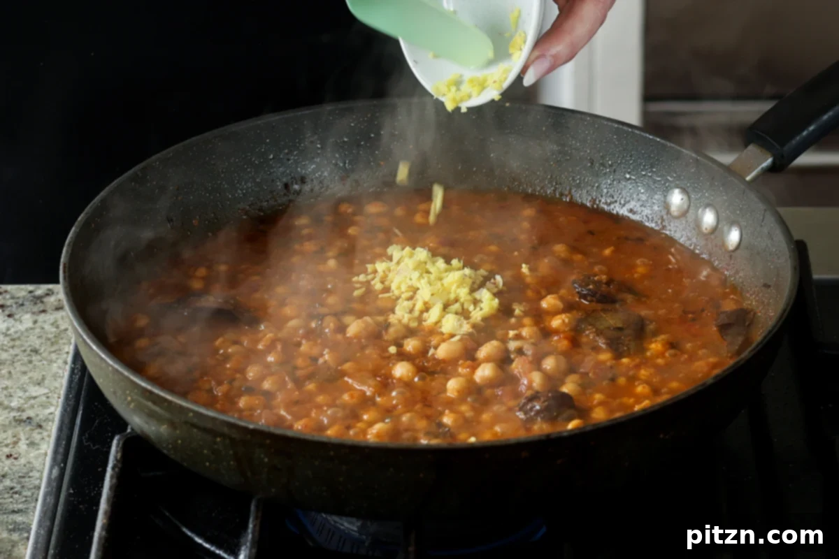 Flavorful Tikki Chole Potato Quinoa Patties and Chickpea Curry 27 adding ginger to the chole