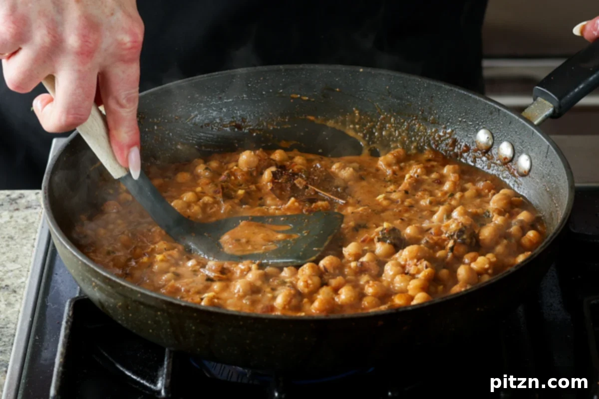 Flavorful Tikki Chole Potato Quinoa Patties and Chickpea Curry 30 mashing some of the chickpeas