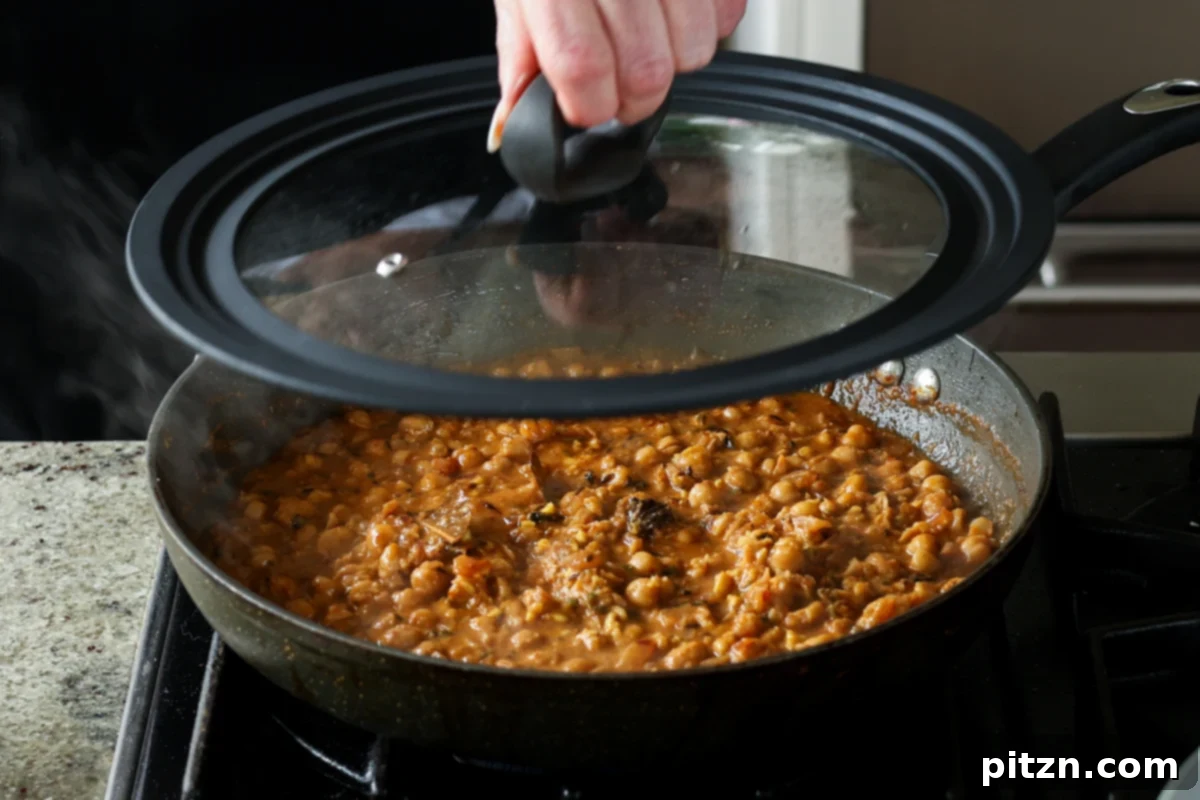Flavorful Tikki Chole Potato Quinoa Patties and Chickpea Curry 31 covering the pan