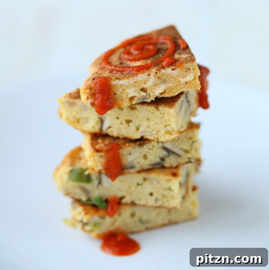 Sliced chickpea flour pancake with melted vegan cheese