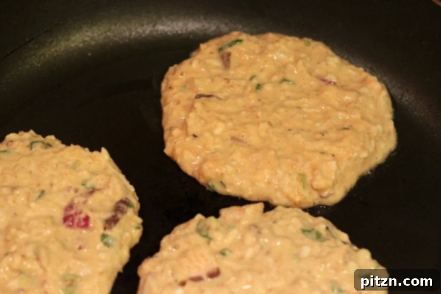 Chickpea flour pancakes cooking on a pan, covered