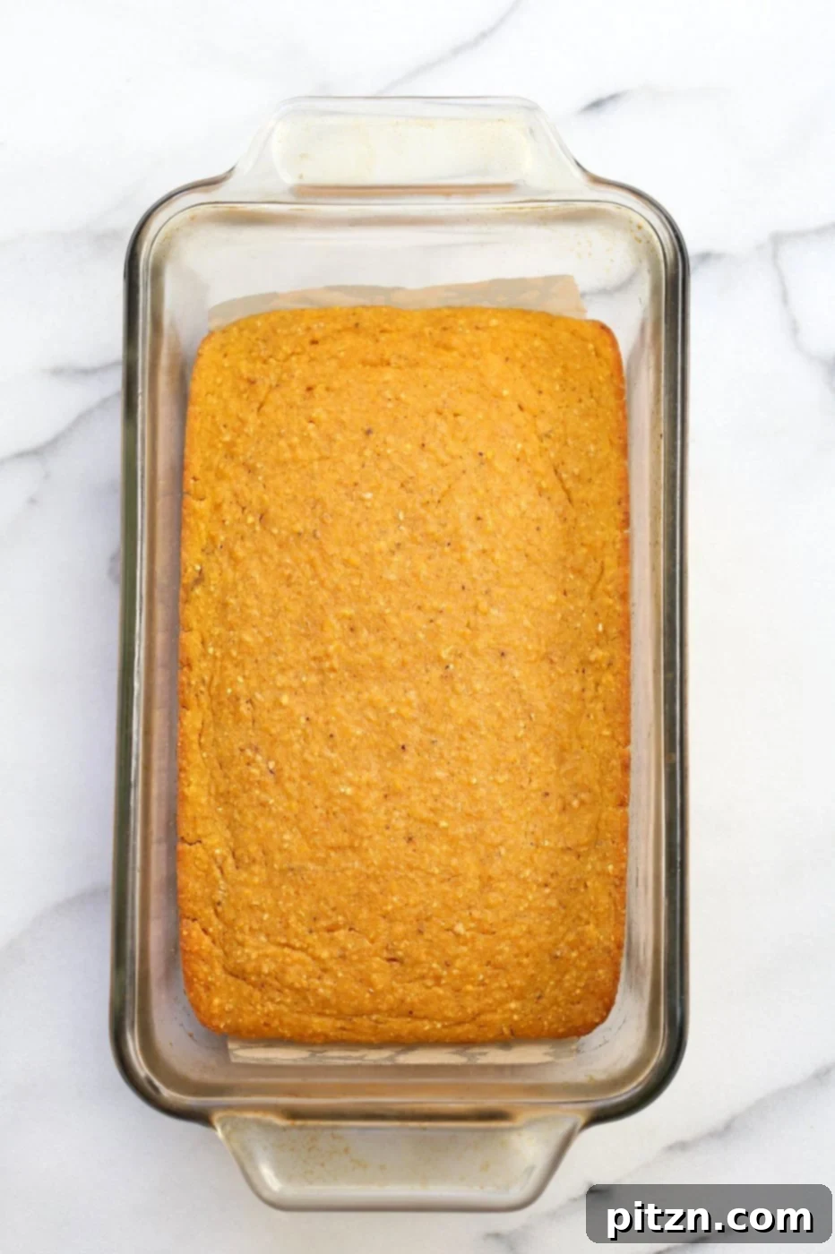 A stack of freshly baked 1-Bowl Vegan Pumpkin Cornbread slices, ready to be enjoyed. Perfect for entertaining or a quick snack. #EasyVegan #Cornbread