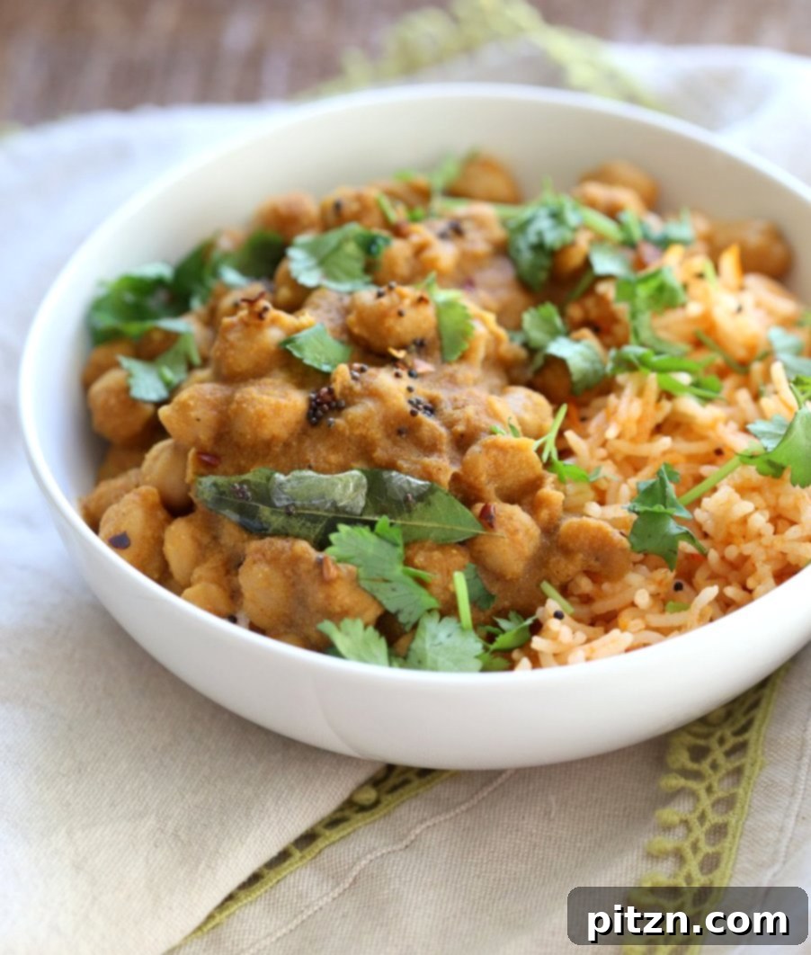 Chana Gassi /Ghassi - Mangalorean Coconut Onion sauce with Chickpeas. Close-up of the delicious, creamy curry, highlighting the texture of chickpeas and the rich, spice-infused sauce. This simplified regional Indian curry is #Vegan, Gluten-free, Soy-free, Nut-free.