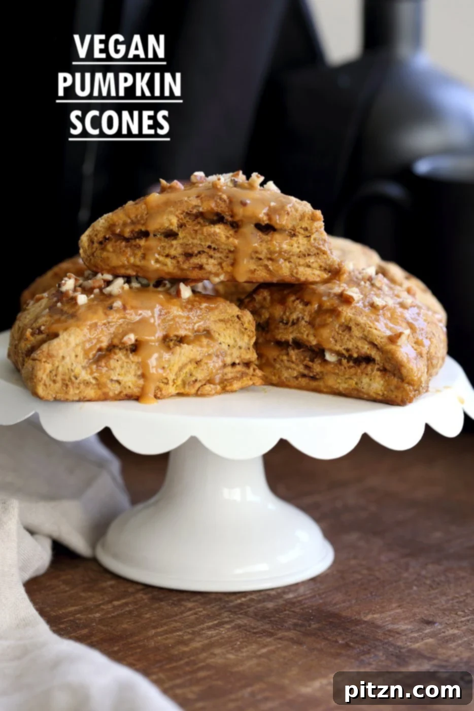 Fluffy oil-free vegan pumpkin scones with a rich spiced pumpkin caramel glaze, ready for breakfast