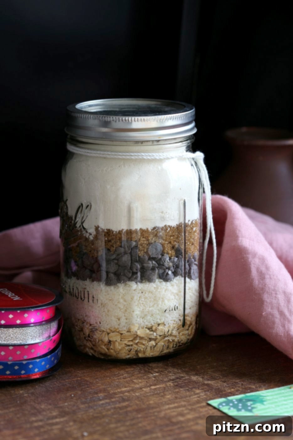 Homemade Vegan Cowboy Cookie Jar Kit 10 Vegan Cowboy Cookies Mix makes great Jar gifts for the Holiday Season. Layer oats, flour, coconut, chocolate sugar and pecans. Mix, add applesauce and oil, and bake. #veganricha #Vegan #Recipe Can be #glutenfree. | VeganRicha.com