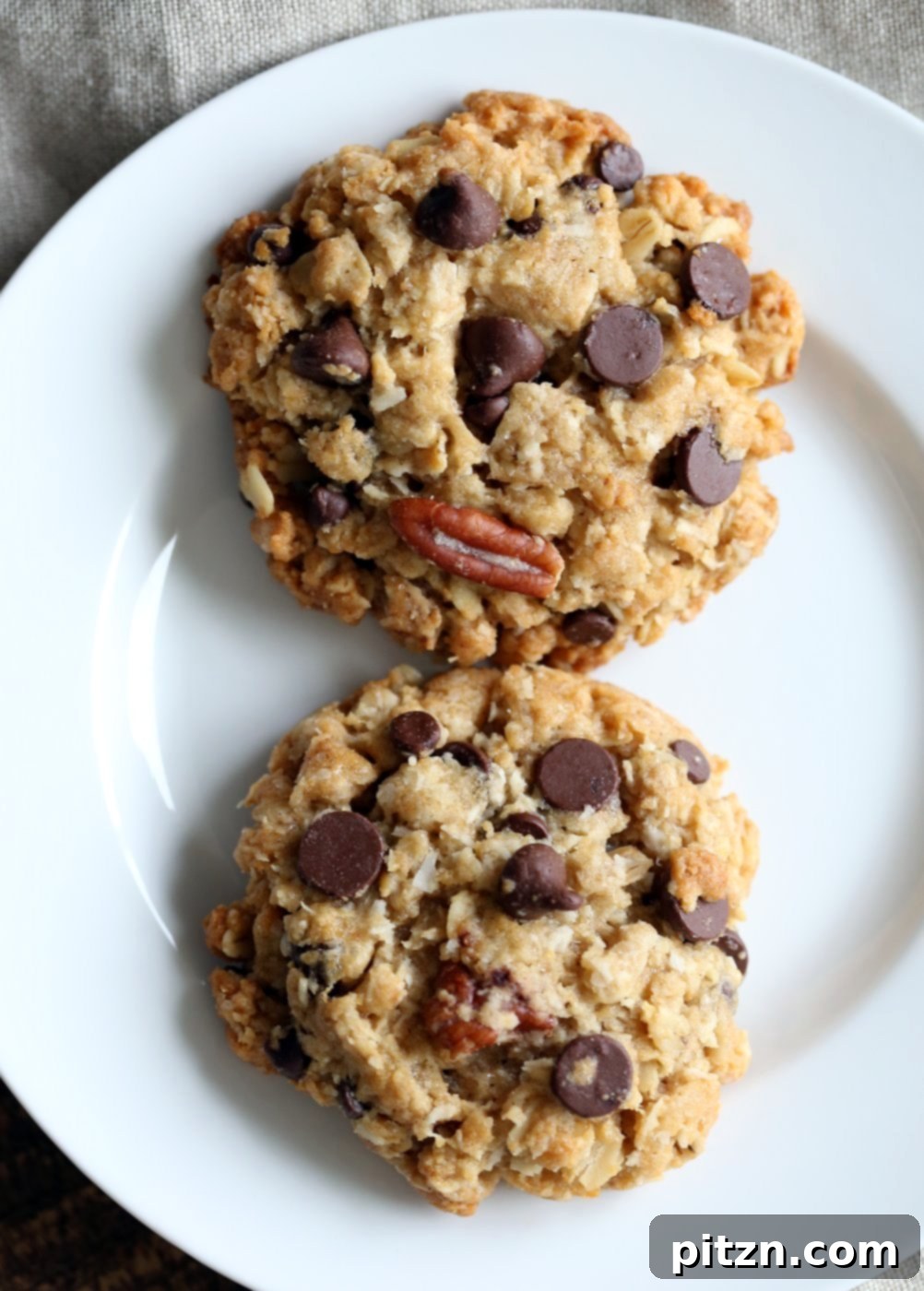 Homemade Vegan Cowboy Cookie Jar Kit 7 Vegan Cowboy Cookies Mix makes great Jar gifts for the Holiday Season. Layer oats, flour, coconut, chocolate sugar and pecans. Mix, add applesauce and oil, and bake. #veganricha #Vegan #Recipe Can be #glutenfree. | VeganRicha.com