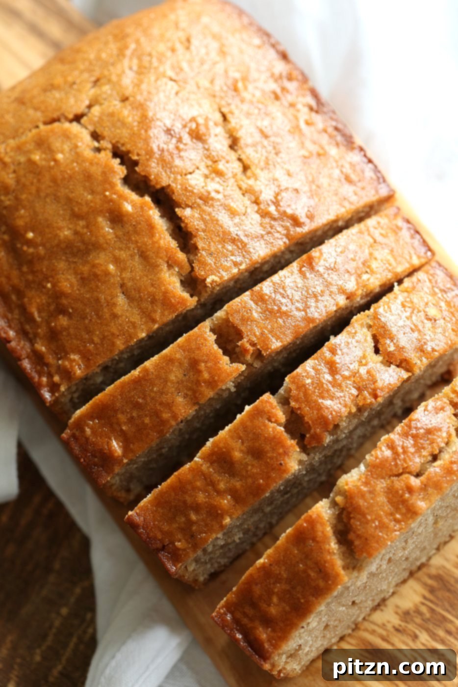 Close-up of a slice of vegan eggnog pound cake, showcasing its dense and moist texture. #vegan #veganricha