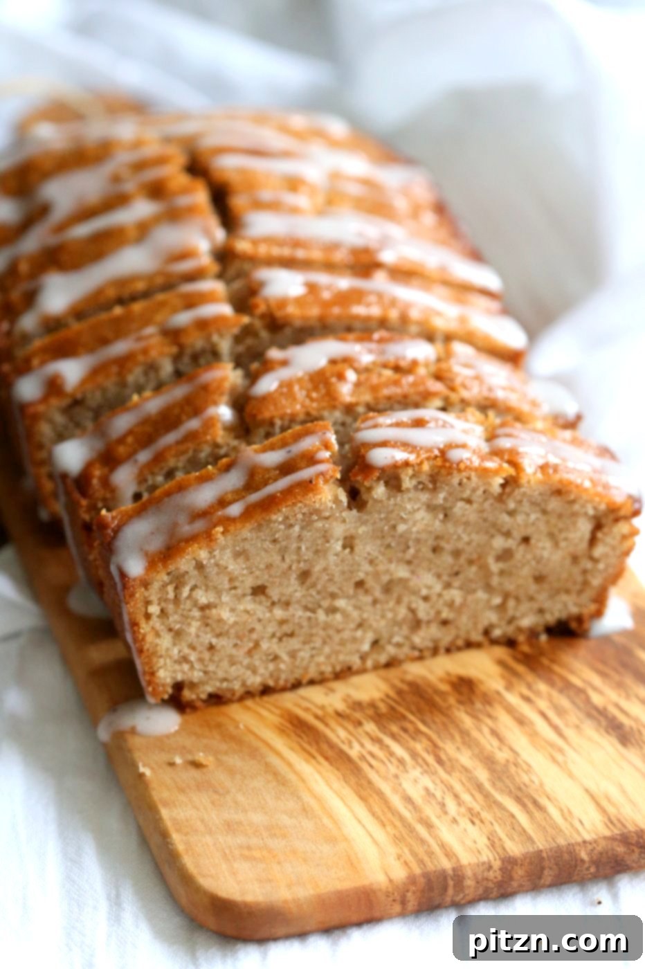 A beautifully sliced vegan eggnog pound cake on a serving platter, ready to be enjoyed. #vegan #veganricha