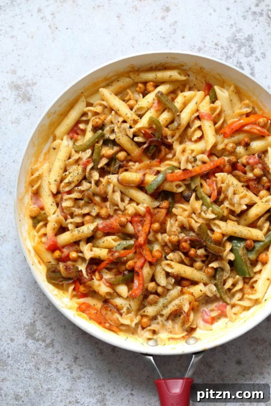 Vegan Fajita Pasta with Chickpeas and veggies. Easy Weeknight pasta with Taco seasoned veggies and beans mixed with creamy pasta. Vegan Soyfree Recipe. Can be gluten-free. #vegan #veganricha