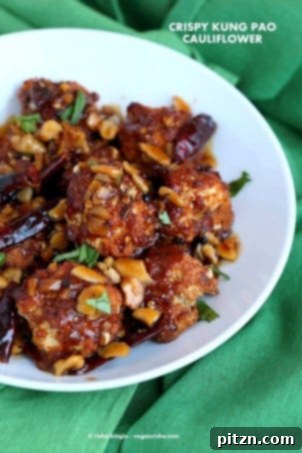 Crispy Kung Pao cauliflower, battered and baked then tossed in a spicy Kung Pao sauce, perfect as a vegan appetizer or snack.