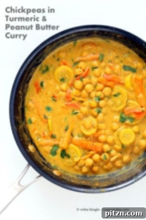 Chickpeas in a vibrant turmeric peanut butter curry sauce with summer veggies, a delicious vegan, gluten-free, and soy-free recipe.