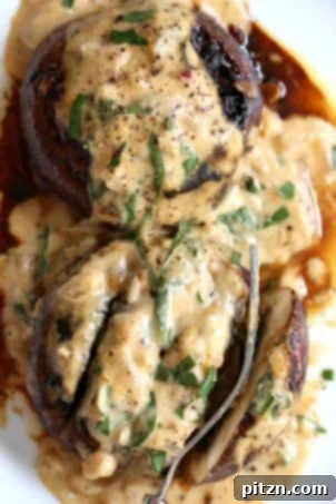 Grilled or baked marinated portobello mushrooms served with a rich, creamy garlic sauce, a delicious vegan and gluten-free recipe.