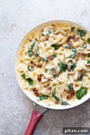 Creamy sun-dried tomato pasta with garlic soy curls, a Tuscan garlic 'chicken' and pasta dish that can be gluten-free, soy-free, and nut-free.