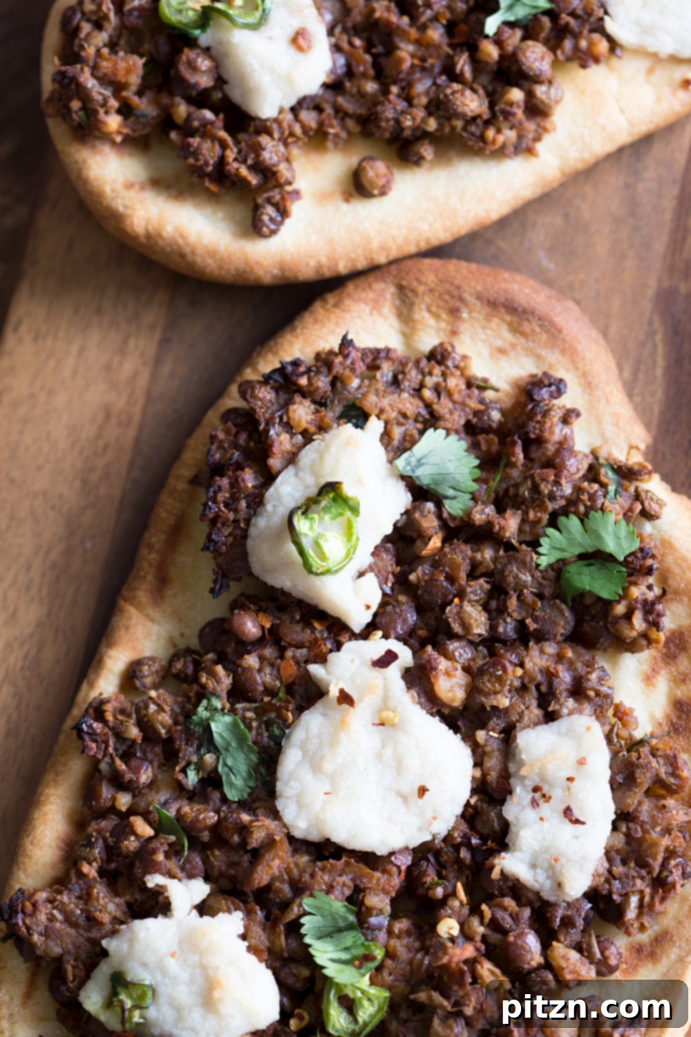 Vegan Lentil Keema Naan 3 Vegan Keema Naan with Keema Lentils, onion, carrots and walnuts. These lentils with the herbs and spices make a vegan version of keema. Serve over Naan bread or Pizza or fill tacos or wraps. #Vegan #Recipe #veganricha, Can be gluten-free and soy free. | VeganRicha,com