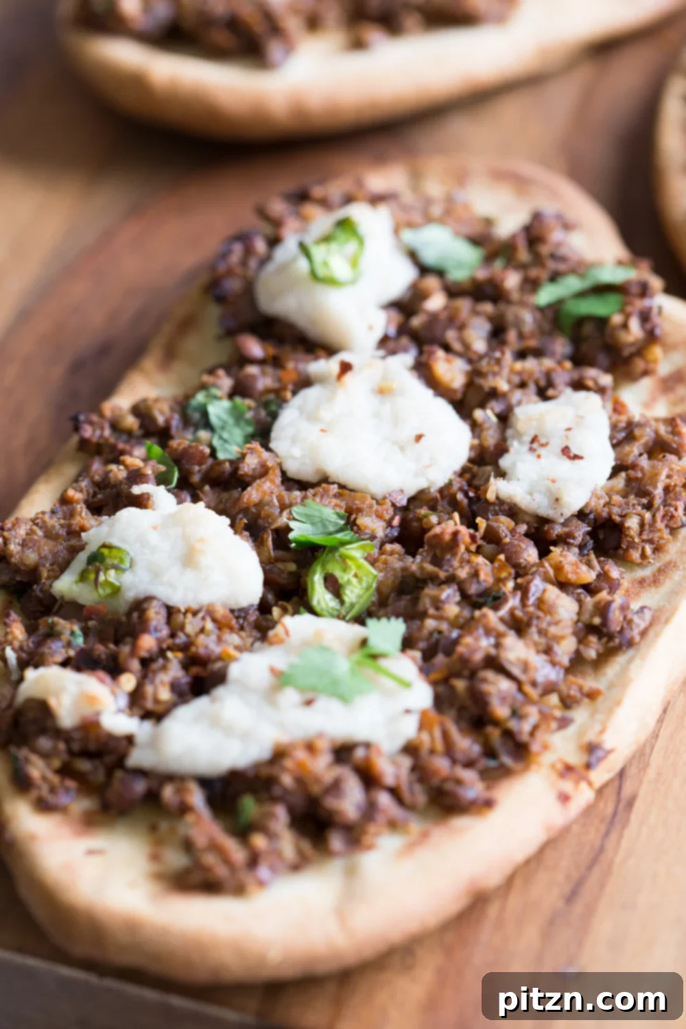 Vegan Lentil Keema Naan 6 Vegan Keema Naan with Keema Lentils, onion, carrots and walnuts. These lentils with the herbs and spices make a vegan version of keema. Serve over Naan bread or Pizza or fill tacos or wraps. #Vegan #Recipe #veganricha, Can be gluten-free and soy free. | VeganRicha,com
