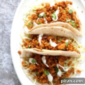 Mango BBQ Soy Curls or Jackfruit Tacos. Shredded Soy Curls or Jackfruit make an amazing carrier for bbq sauce. Some Mango or other fruit puree takes it to the next level. Serve in sandwiches or tacos with slaw. #Vegan #Glutenfree #Recipe #veganricha | VeganRicha.com