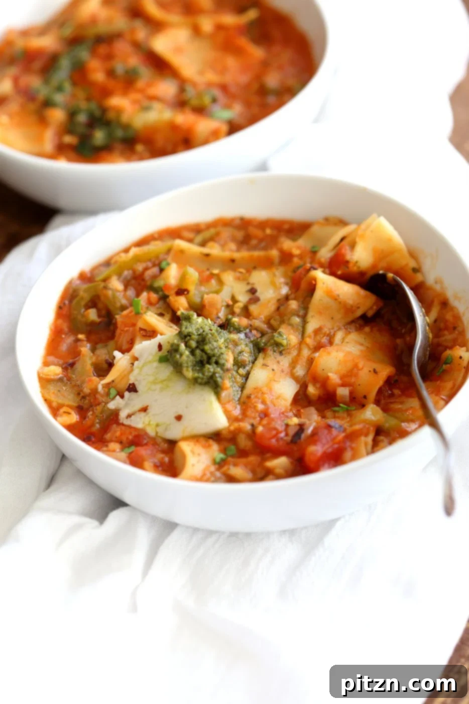 Plant-Based Instant Pot Lasagna Soup 3 Two white bowls filled with our Instant Pot Vegan Lasagna Soup, ready to be served.