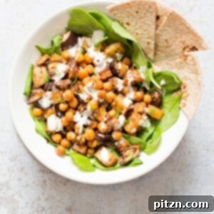 Roasted Eggplant Potatoes Chickpeas with Moroccan Merguez seasoning. Veggies tossed in Merguez blend, roasted then served with tahini dressing. Vegan Gluten-free Soy-free Recipe. VeganRicha.com