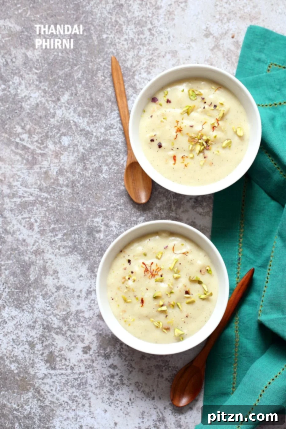 Creamy Thandai Phirni garnished with fresh pistachios and dried rose petals
