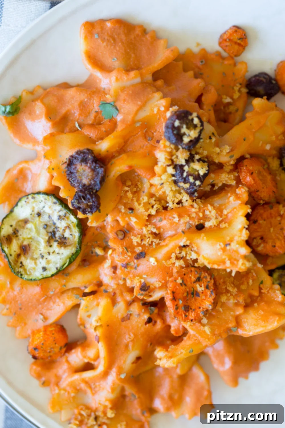 Bow-Tie Bliss: Vegan Rose Sauce with Roasted Garden Medley 6 Delicious and healthy Vegan Rose Sauce Farfalle Pasta, featuring a rich tomato cream sauce, colorful roasted vegetables, and a sprinkle of fresh herbs.