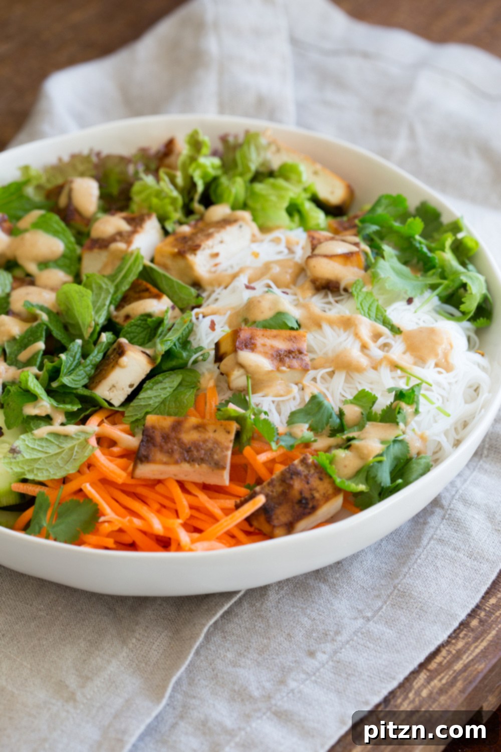 Crunchy Veggie Vegan Summer Rolls Deconstructed into a Bowl. Served with Peanut Butter Dipping Sauce. Fresh Spring Rolls/ Rice paper rolls in a bowl. Make a bowl, wrap or fill up rice paper wrappers. Vegan Gluten-free Recipe. No Refined Sugar or Oil. Use Sunbutter to make it nutfree