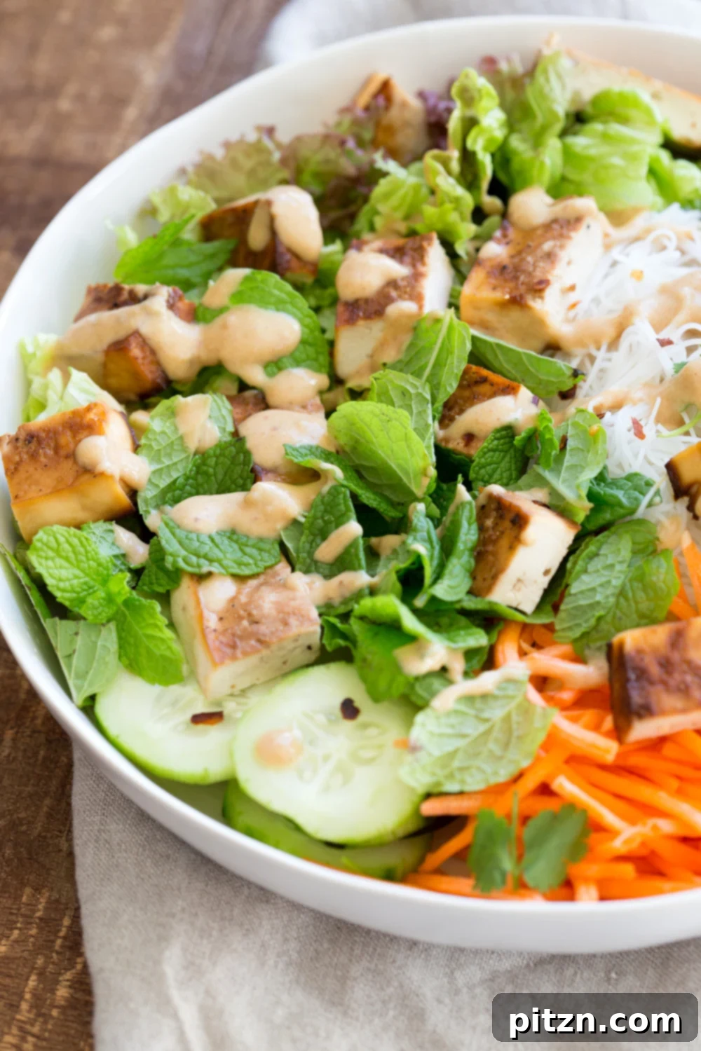 Crunchy Veggie Vegan Summer Rolls Deconstructed into a Bowl. Served with Peanut Butter Dipping Sauce. Fresh Spring Rolls/ Rice paper rolls in a bowl. Make a bowl, wrap or fill up rice paper wrappers. Vegan Gluten-free Recipe. No Refined Sugar or Oil. Use Sunbutter to make it nutfree
