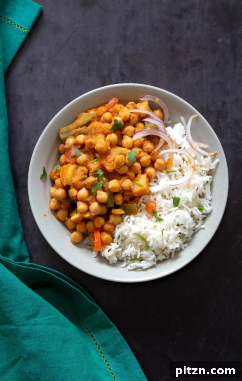 Kadai Chole is a delicious Chickpea curry generally made in wok. 1 Pot 30 min Spiced Chickpeas and Potatoes. Simple Indian sauce paired here with potatoes. #Vegan #Indian #Glutenfree #Soyfree #Nutfree #Recipe #indianvegan #VeganRicha