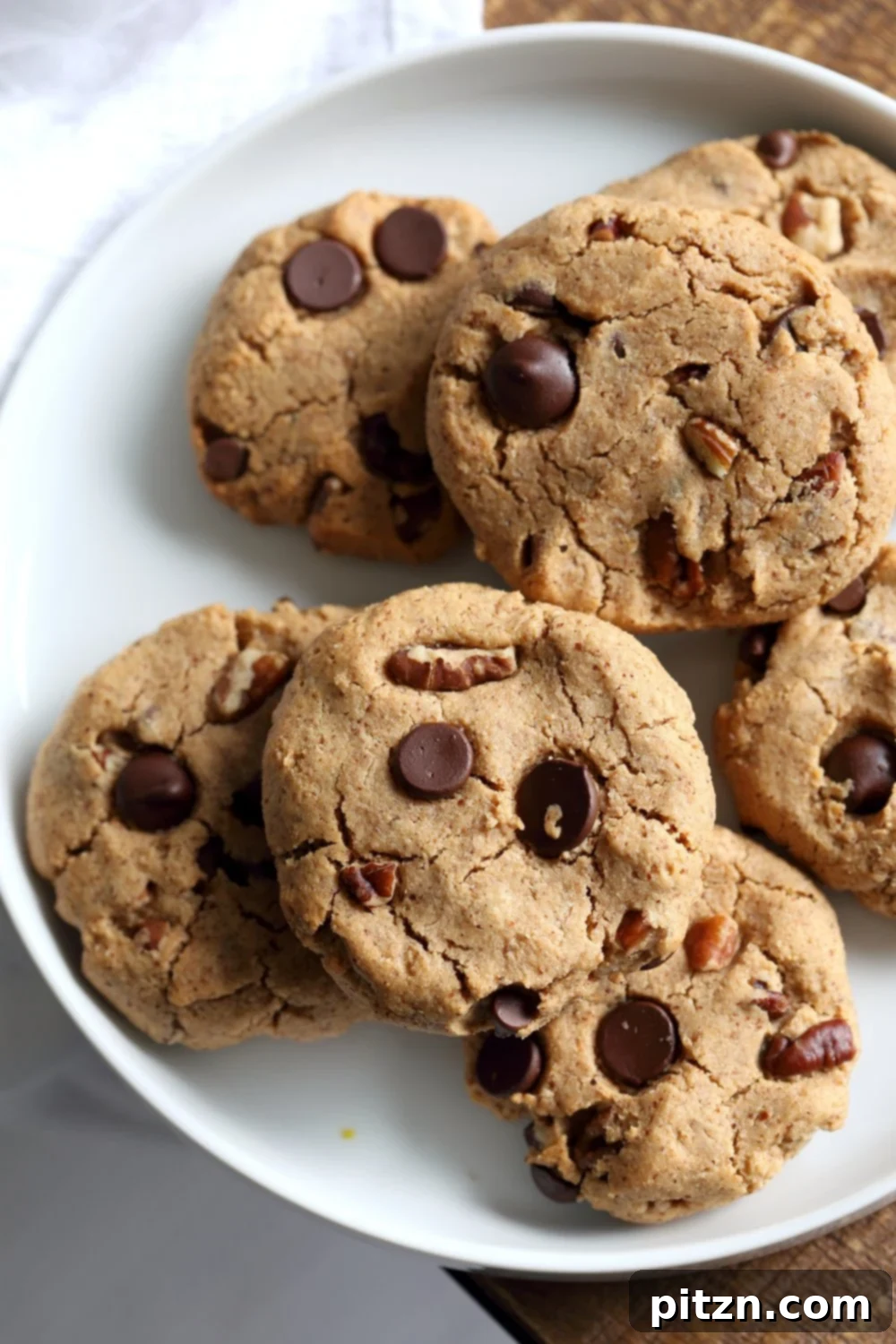Vegan Paleo Grain free Chocolate Chip Cookies with Coconut flour and Almond Butter. These fudgy cookies are a perfect treat or snack. No refined oil and no refined sugar. #Vegan #Glutenfree #Grainfree #paleo #Recipe #veganricha | VeganRicha.com