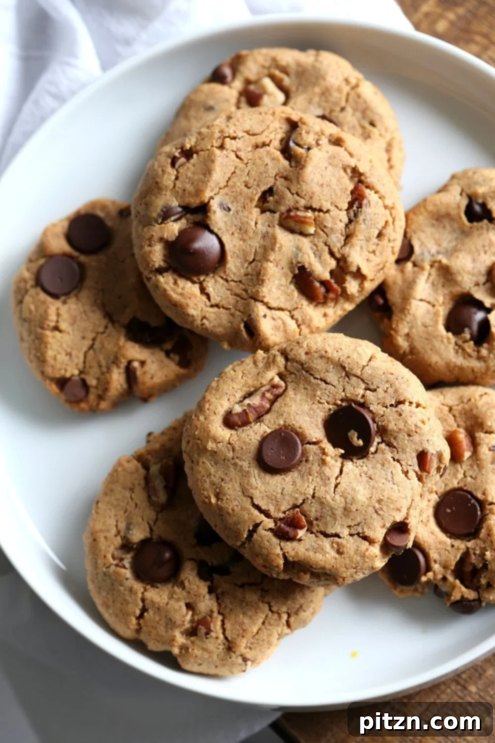 Vegan Paleo Grain free Chocolate Chip Cookies with Coconut flour and Almond Butter. These fudgy cookies are a perfect treat or snack. No refined oil and no refined sugar. #Vegan #Glutenfree #Grainfree #paleo #Recipe #veganricha | VeganRicha.com
