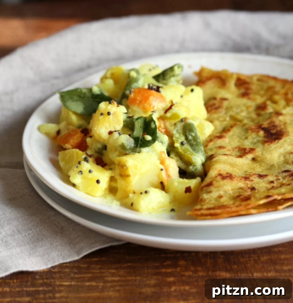 A comforting bowl of vegan, gluten-free Avial, highlighting fresh ingredients.