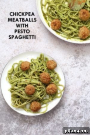Amazing Pesto Spaghetti with Vegan Meatballs made from chickpeas and walnuts, a delicious and soy-free meal ready in 40 minutes.