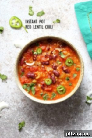 20 Affordable Vegan Meals 6 A bowl of Instant Pot Red Lentil Chili, a quick and delicious vegan chili recipe, perfect for a hearty and budget-friendly meal.
