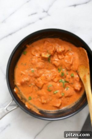 Restaurant Style Tofu Butter Masala, a delicious dairy-free 'Paneer' Butter Masala with marinated and baked tofu in a rich tomato-ginger-cashew sauce. A flavorful vegan and gluten-free recipe.