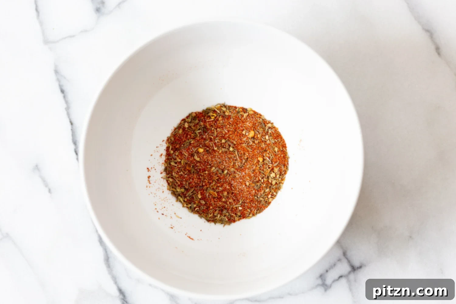Spicy Cajun Cauliflower Steaks with Fresh Chimichurri 4 Homemade Cajun Spice Blend, a mix of paprika, cayenne, oregano, garlic powder, thyme, and onion powder, ready for seasoning roasted cauliflower steaks.