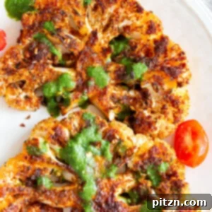 Vegan Cajun Roasted Cauliflower Steaks with Chimichurri Sauce. Thick slices or florets seasoned with bold Cajun spices, ready to be served. A healthy, gluten-free, soy-free, nut-free vegan recipe.