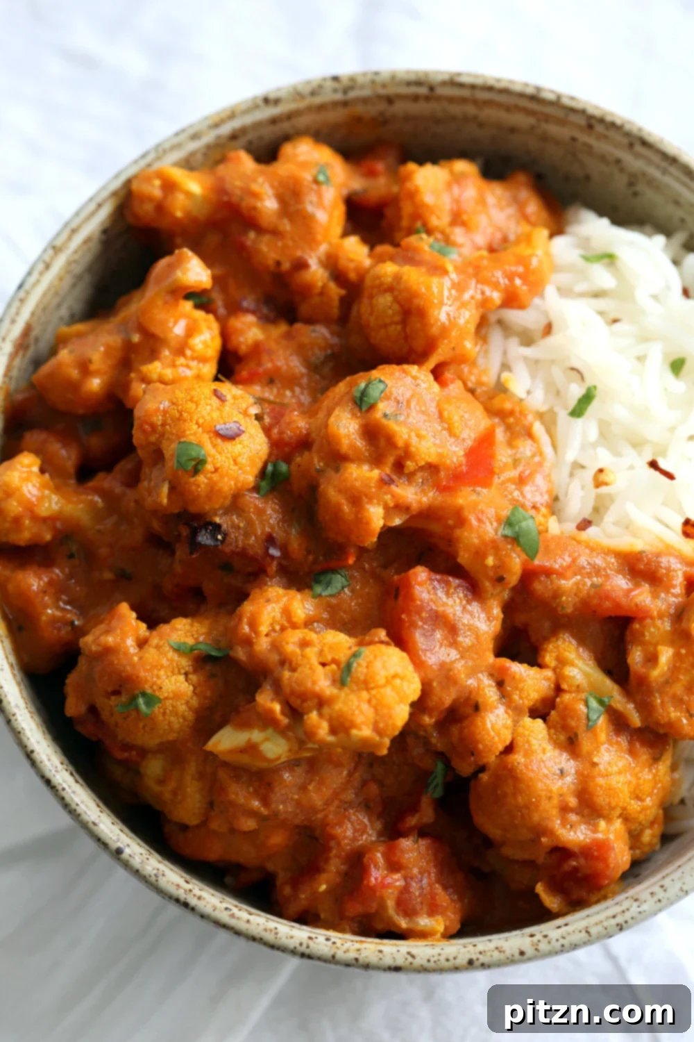 Instant Pot Vegan Tikka Masala 3 Cauliflower Tikka Masala made with homemade Vegan Tikka Masala Sauce, served with fresh herbs