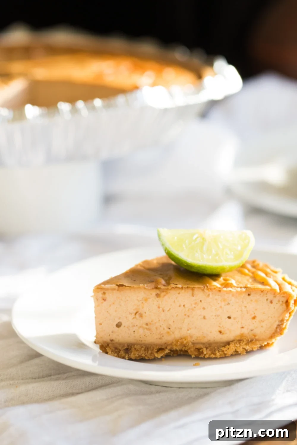 Naturally Sweetened Baked Vegan Gluten-Free Cheesecake 3 Baked Vegan Cheesecake slice on a white plate
