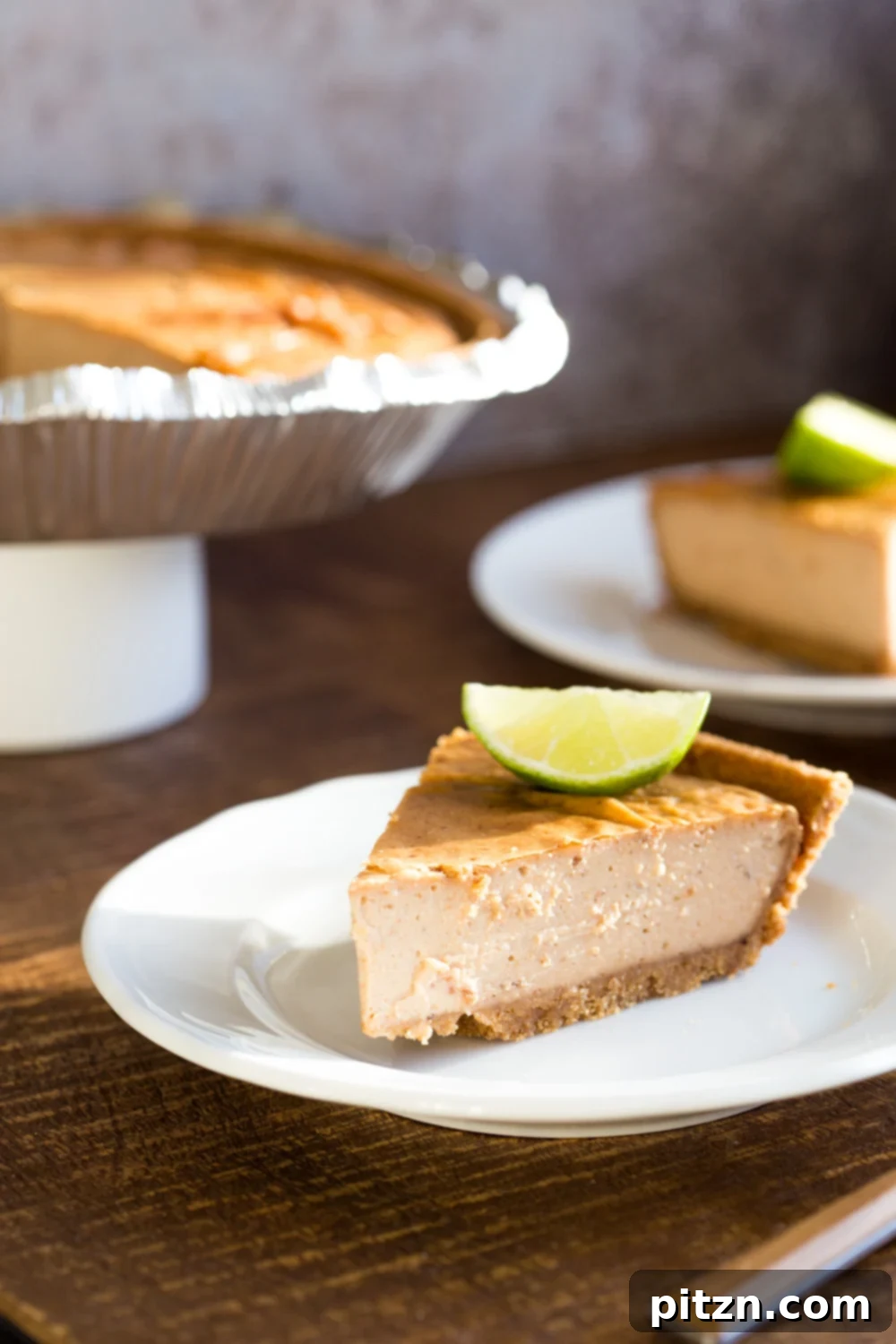 Naturally Sweetened Baked Vegan Gluten-Free Cheesecake 8 Baked Vegan Cheesecake. 8 Ingredients, no refined sugar. No prep and soaking needed. Perfectly creamy Date sweetened Cheesecake with Cashew butter. Easily Glutenfree with a glutenfree crust. #Vegan #Soyfree #Recipe #VeganRicha #cheesecake #vegancheesecake