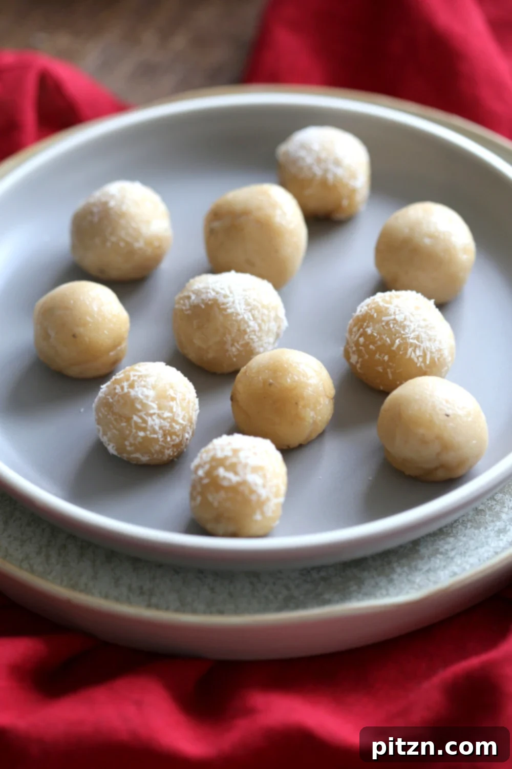 Vegan Malai Ladoo Cardamom Fudge Balls 3 Close-up shot of several Vegan Malai Ladoo, showing their soft texture and delicate cardamom flavor.