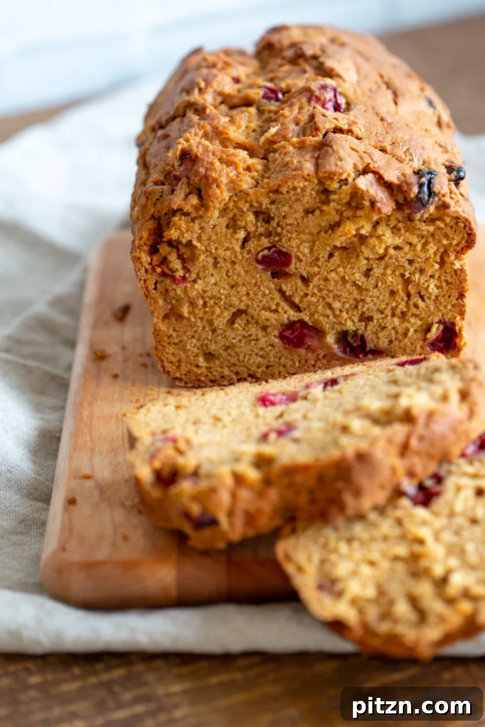 Golden One Bowl Vegan Sweet Potato Loaf 8 Vegan Sweet Potato Bread sliced on a wood cutting board