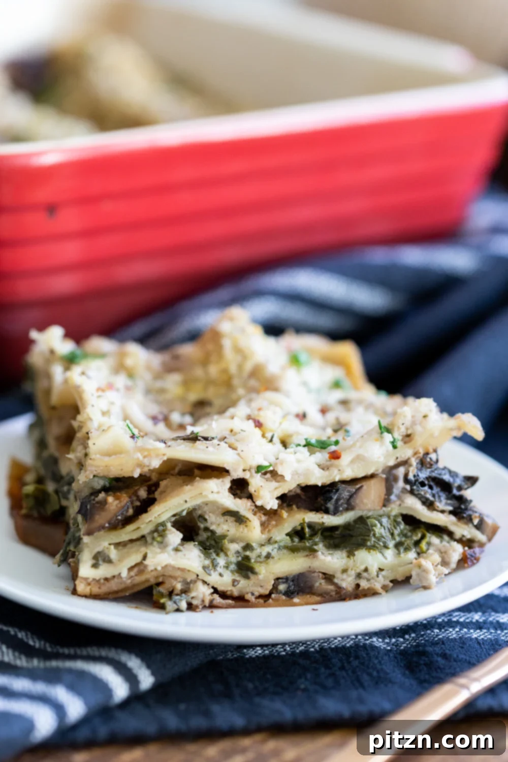 Decadent Vegan Mushroom Lasagna 12 A delicious slice of Creamy Vegan Mushroom Lasagna served on a elegant white plate