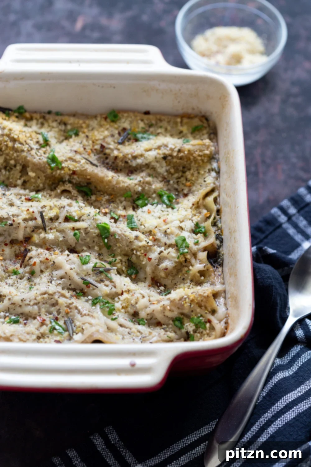 Decadent Vegan Mushroom Lasagna 3 Hearty Creamy Vegan Mushroom Lasagna in a red and white baking dish, ready to serve