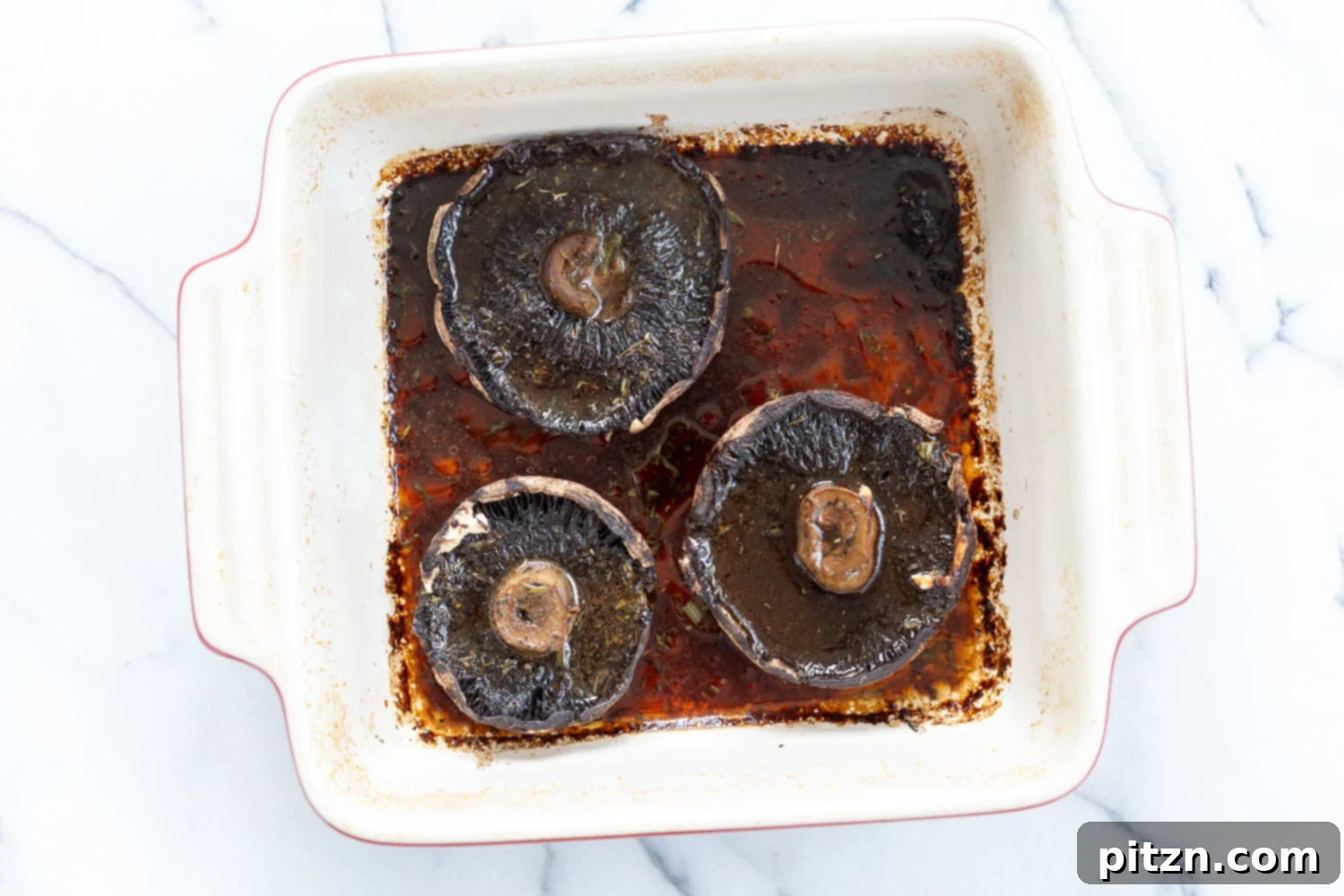 Decadent Vegan Mushroom Lasagna 6 Marinated and baked portobello mushrooms resting in a stoneware dish for Creamy Vegan Mushroom Lasagna