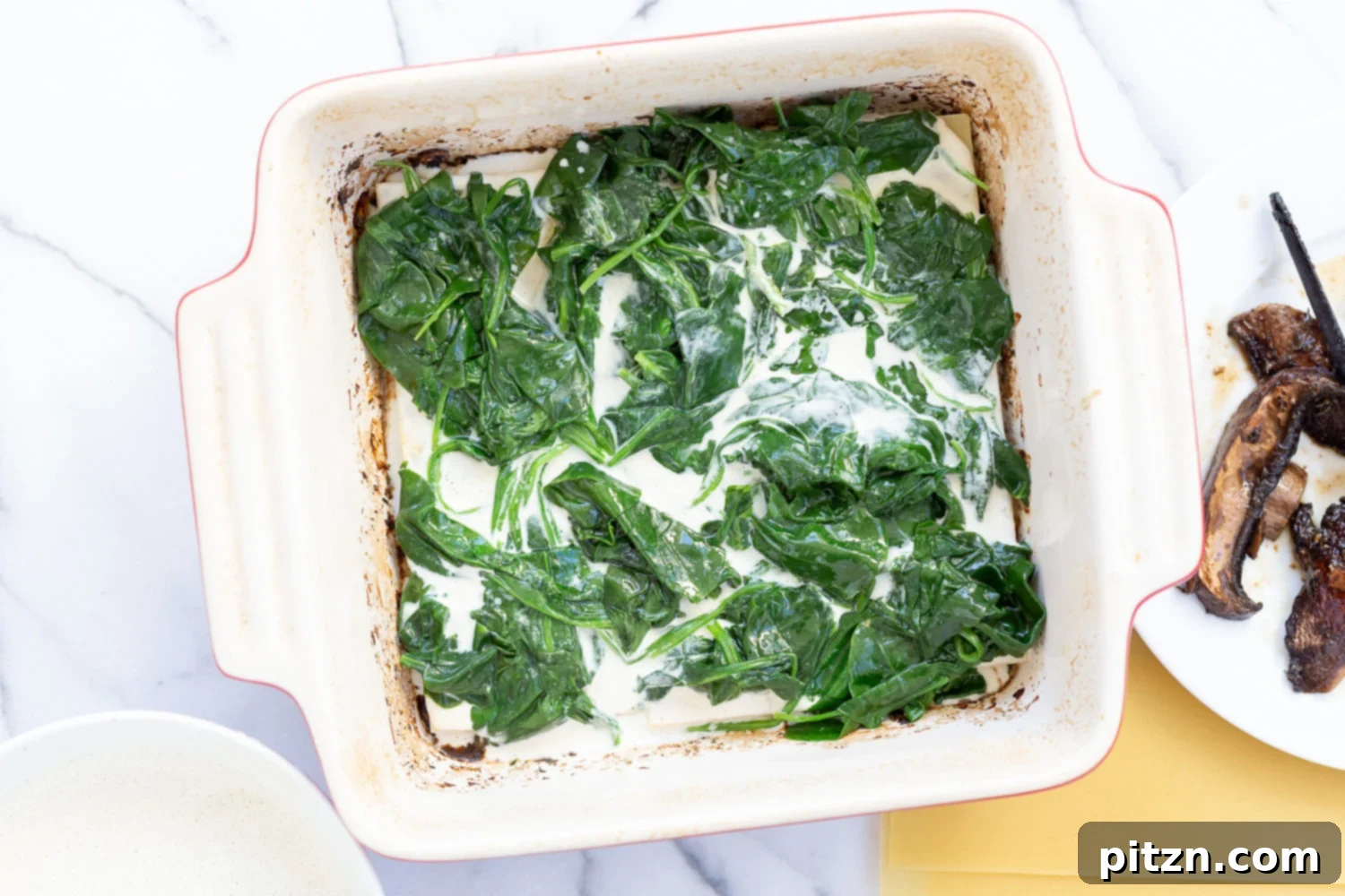 Decadent Vegan Mushroom Lasagna 9 Lasagna noodles layered with fresh spinach and creamy garlic sauce for a delicious vegan dish