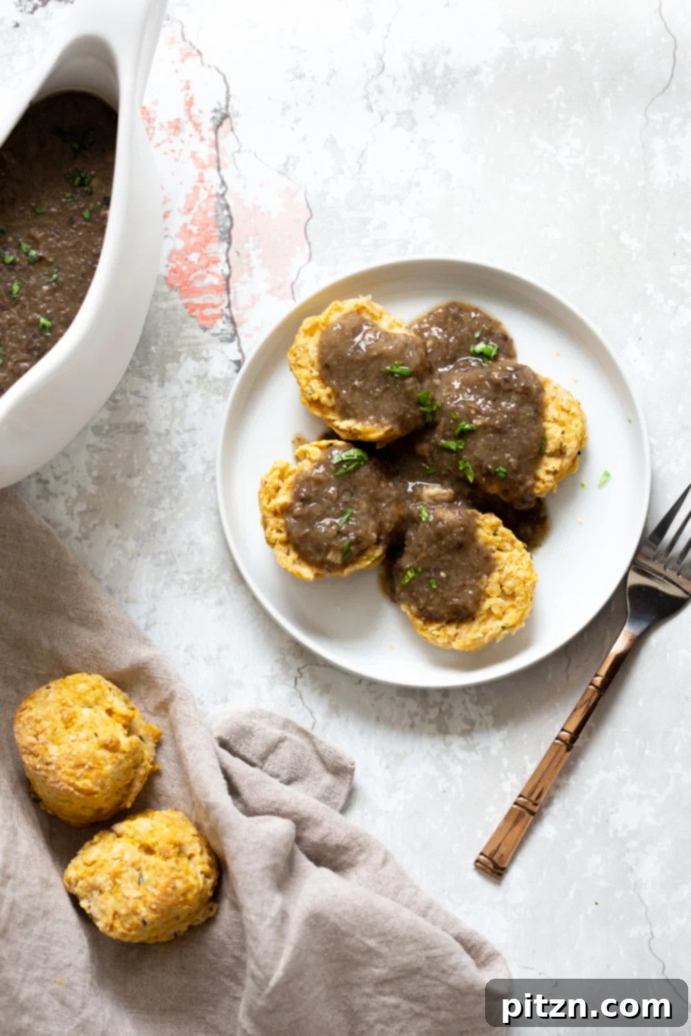 Fluffy oil-free vegan biscuits, perfect for any meal. These herbed biscuits are dairy-free, low-fat, and easy to make in one bowl.