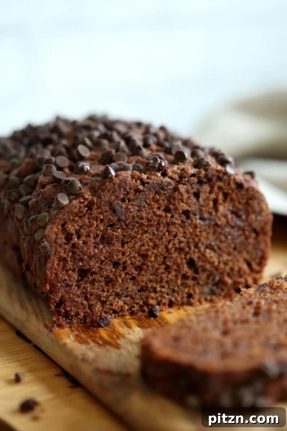 Spiced Vegan Chocolate Gingerbread Delight 7 Freshly baked Vegan Chocolate Gingerbread Cake cooling on a wire rack.
