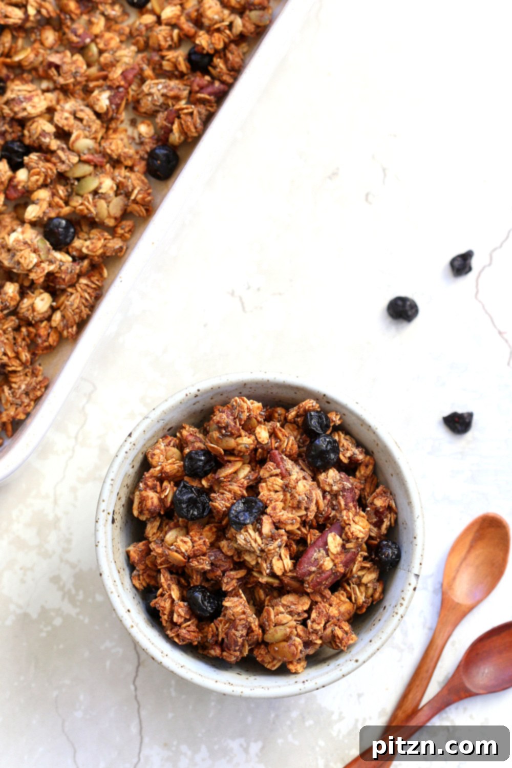 This Date Caramel Maple Pecan Granola is lightly sweet and perfect for any time. Pecans, Oats, coconut, pumpkin and chia seeds and dried blueberries tossed in date caramel and baked to perfection. #Vegan #Granola #Glutenfree #Soyfree #Recipe #VeganRicha Can be nutfree.