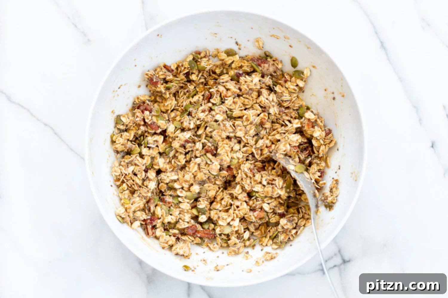 This Date Caramel Maple Pecan Granola is lightly sweet and perfect for any time. Pecans, Oats, coconut, pumpkin and chia seeds and dried blueberries tossed in date caramel and baked to perfection. #Vegan #Granola #Glutenfree #Soyfree #Recipe #VeganRicha Can be nutfree.
